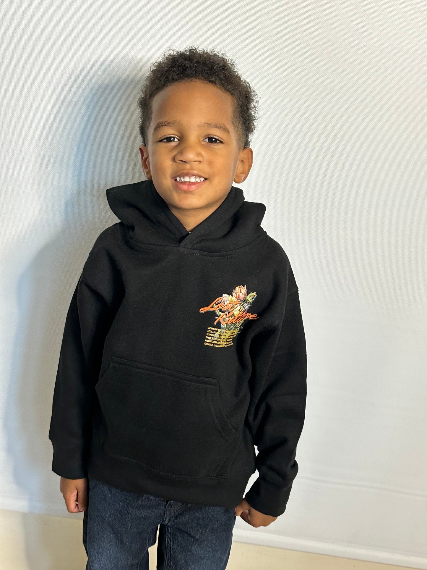 A boy wearing Lost Kulture Growth and Grace Youth Hoodie a product from lost kulture the best clothing store, best men clothing brands best clothing for men clothing stores online clothing