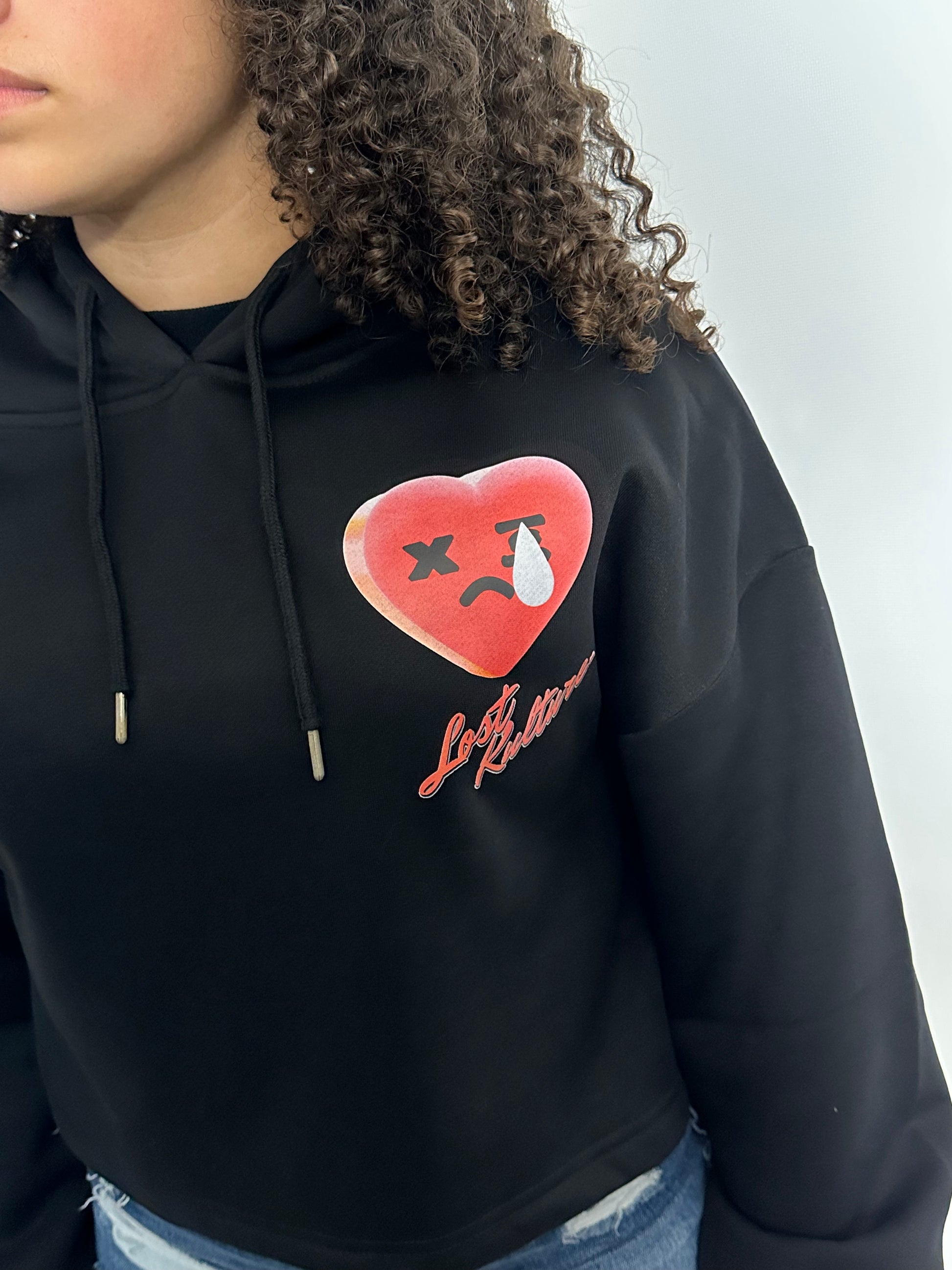 A lady weating Lost Kulture Pain Ladies Crop Hoodie a product from lostkulture the best clothing store, best men clothing brands best clothing for men clothing stores online clothing