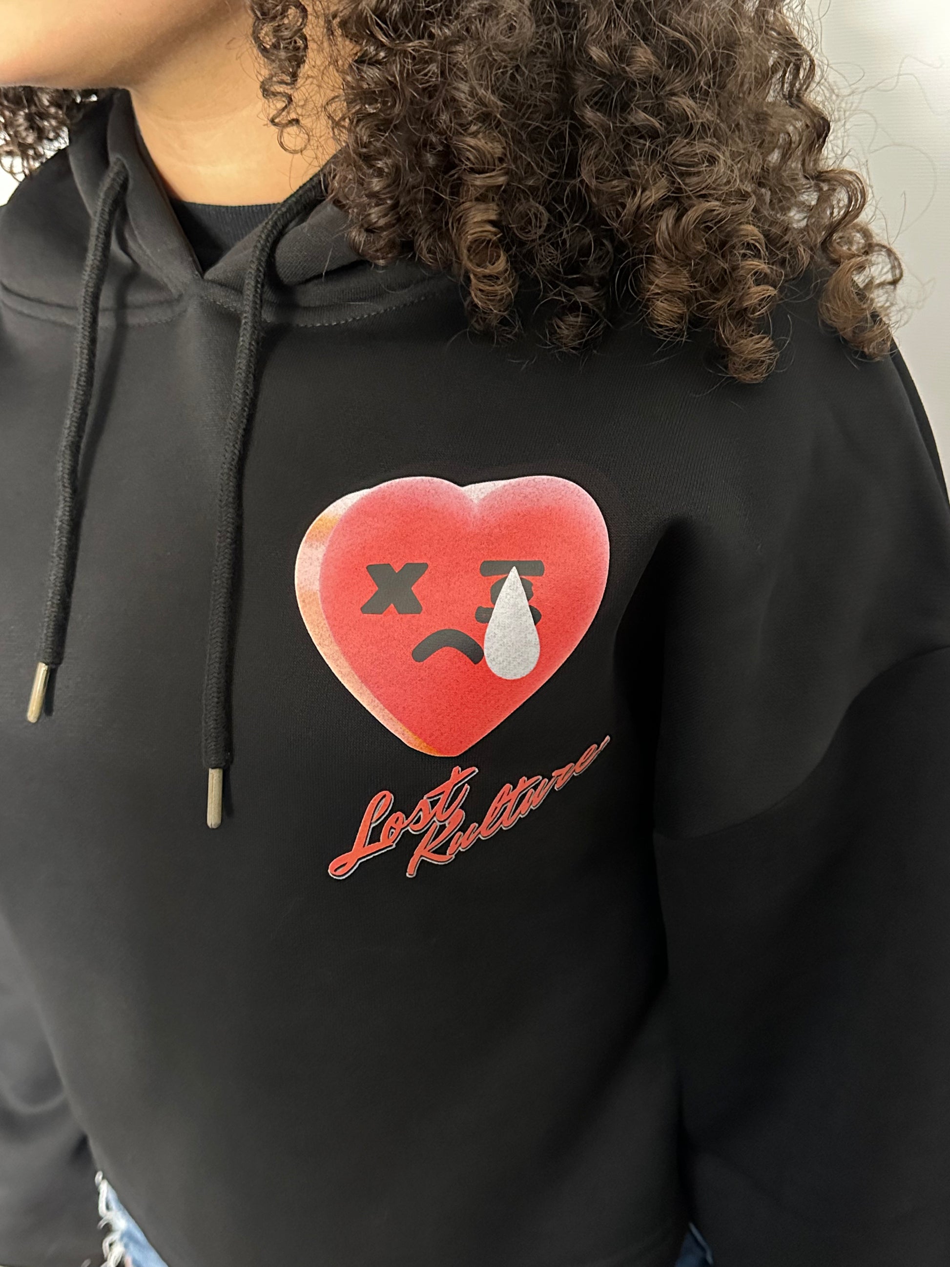 A lady weating Lost Kulture Pain Ladies Crop Hoodie a product from lostkulture the best clothing store, best men clothing brands best clothing for men clothing stores online clothing