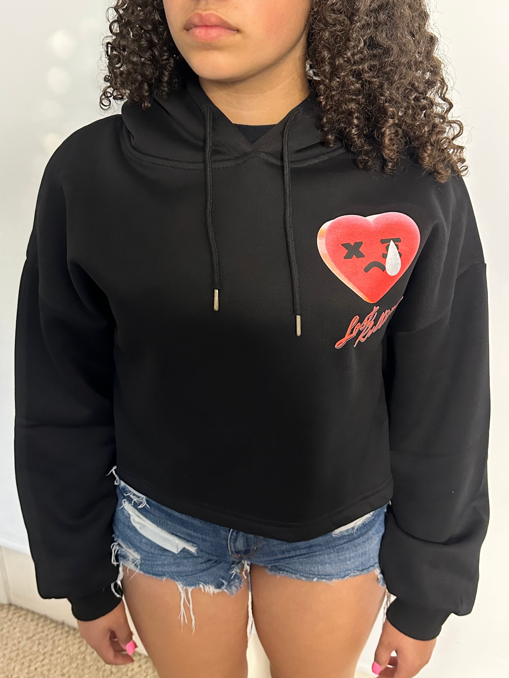A lady weating Lost Kulture Pain Ladies Crop Hoodie a product from lostkulture the best clothing store, best men clothing brands best clothing for men clothing stores online clothing